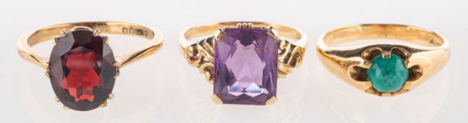 A group of three gem-set rings, including a 'gypsy' style ring set with a turquoise cabochon,