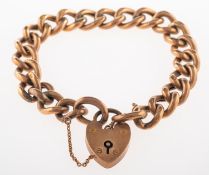 A curb link bracelet, with heart padlock and safety chain, hollow links, marked 9c, length approx.