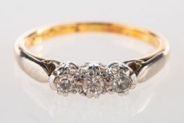 A three stone diamond ring, claw set with three older brilliant-cut diamonds, diamonds approx. 0.
