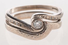 A group of two 18ct white gold rings,