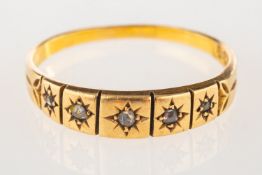 An 18ct gold Victorian five stone ring, star set with five small rose-cut diamonds, UK hallmark,