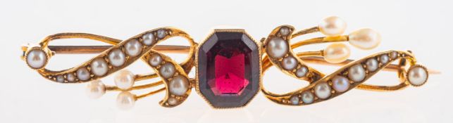 An antique bar brooch, collet set with an octagonal-cut garnet,