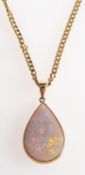 A 9ct gold opal pendant and chain, a pendant set with a pear-shaped opal cabochon, UK hallmark,