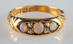 An 18ct gold antique opal and diamond ring, set with three opal cabochons,