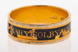 A Georgian memorial ring, with black and white enamelling and inscribed ' Mary Solby Wilcox,