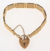 A gate bracelet, with heart padlock and safety chain, partial UK hallmark, .375, length approx. 20.