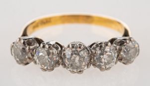 A five stone diamond ring, claw set with five old-cut diamonds, approx. 1.
