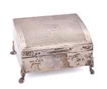 A George V silver cigarette casket by Hukin & Heath Ltd, Birmingham 1926, of bowed rectangular form,