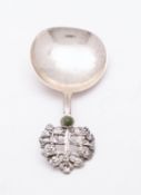 An Arts & Crafts silver caddy spoon by The Artificer's Guild, London 1923,