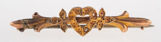 An antique heart brooch, set with one seed pearl, all others missing from settings,