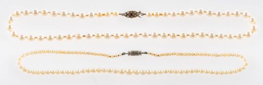 A group of two pearl necklaces,