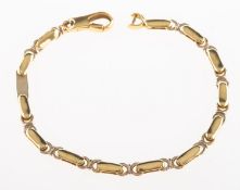 An 18ct gold bracelet, of alternating oblong and openwork circular links, UK hallmark,
