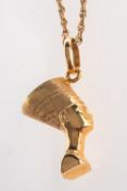 An Egyptian Pharaoh head pendant, marked 750, length approx. 3.0cm (inc. bale), 4.