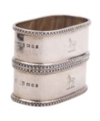 A pair of George V cased silver napkin rings by Asprey & Co Ltd, London 1925, of oval form,