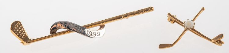 A group of two golf theme brooches, including a golf brooch, engraved 'Captain 1992',