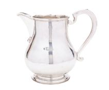 An Elizabeth II silver baluster beer jug by A Haviland-Nye, retailed by The Silver Club,