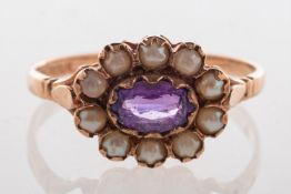 A 9ct rose gold amethyst and pearl ring, set an oval-cut amethyst with a surround of split pearls,