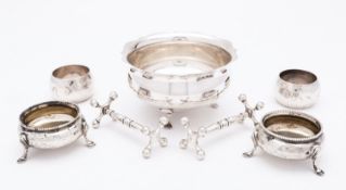 A mixed group of silver; including a pair of George V silver knife rests by Walker and Hall,