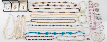 A mixed group of costume jewellery, to include brooches, bangles, earrings, bead necklaces,