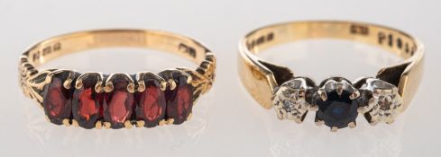 A group of two 9ct gold gem-set rings,