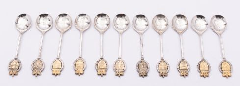A set of eleven Elizabeth II Common Wealth silver commemorative tea spoons by Tower Mint Ltd,