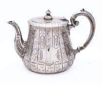 A Victorian silver tea pot by Martin, Hall & Co, Sheffield, 1859,