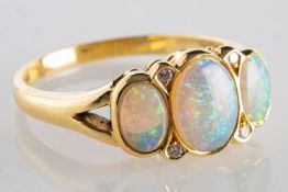 An 18ct gold opal & diamond ring,