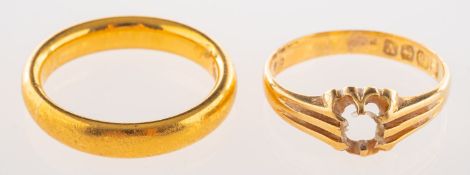 A group of two rings, including a 22ct yellow gold wedding band, UK hallmark, size L1/2, 6.