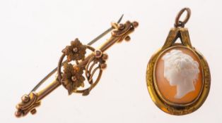 An antique bar brooch and a cameo pendant, the bar brooch of floral & foliate decoration, marked 9 .