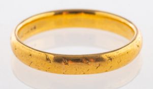 A 22ct yellow gold wedding band, indistinct UK hallmark, size Q1/2, 4.8grams.