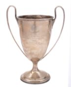 Military interest: An Edward VII large two handled silver trophy cup by Page,