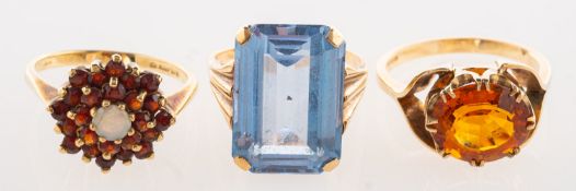 A group of three 9ct gold rings,