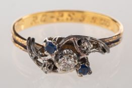 A diamond and sapphire ring, an openwork twist design ring set with a brilliant-cut diamond,