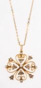 An antique seed pearl pendant and chain, an openwork pendant set with seed pearls,