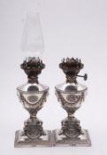 A pair of Edwardian silver oil bedside lamps by Martin, Hall & Co (Richard Martin & Ebenezer Hall),