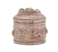 A Burmese silver box, un-marked, of circular form with pull off lid,