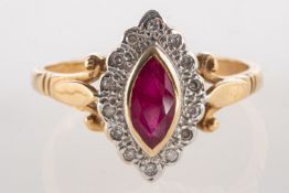 A 9ct gold ruby & diamond ring, a navette shaped ring set to the centre with a marquise-cut ruby,