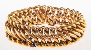 An antique bracelet, of interlinked 'figure of eight' links with a safety chain threaded throughout,