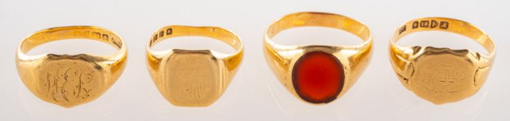 A group of four signet rings, three 18ct yellow gold signet rings with engraved initials,