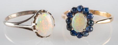 A group of two opal rings,