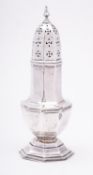 A George V silver sugar shaker by Walker and Hall, Chester marks rubbed, of octagonal baluster form,
