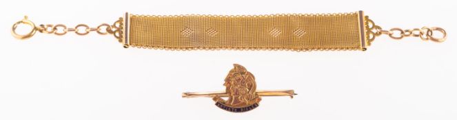 An antique watch fob and a bar brooch,