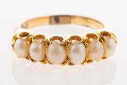 A pearl ring, claw set with six freshwater pearls, unmarked, tests as 14ct gold,