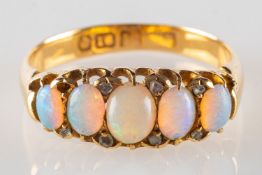 An antique 18ct gold opal set ring,