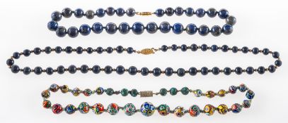 A group of three bead necklaces,