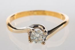 A diamond solitaire ring, with twist designed shoulders and set with a brilliant-cut diamond,