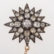 A Victorian diamond star brooch, claw and grain set with old cushion-cut diamonds, diamonds approx.