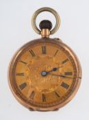 A 9ct gold open-faced pocket watch the engraved gold dial having black Roman numerals and