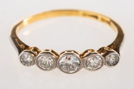 A five stone diamond ring, bezel set with graduated old-cut diamonds, diamonds approx. 0.