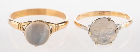 A carved 'man on the moon' moonstone ring and one other ring,